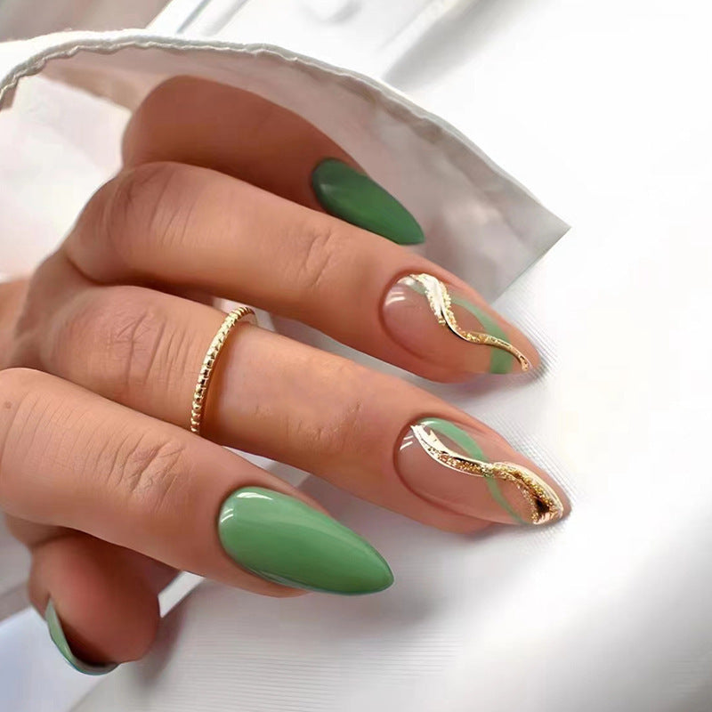 Glamorous artificial nails with elegant gold accents