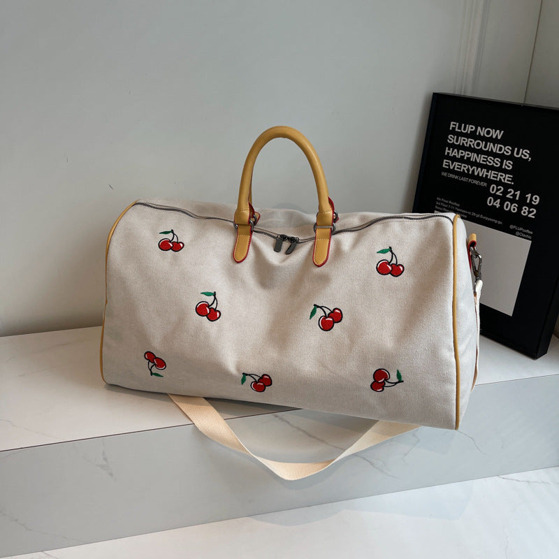 Sporty weekend bag with playful cherry pattern Stornfield
