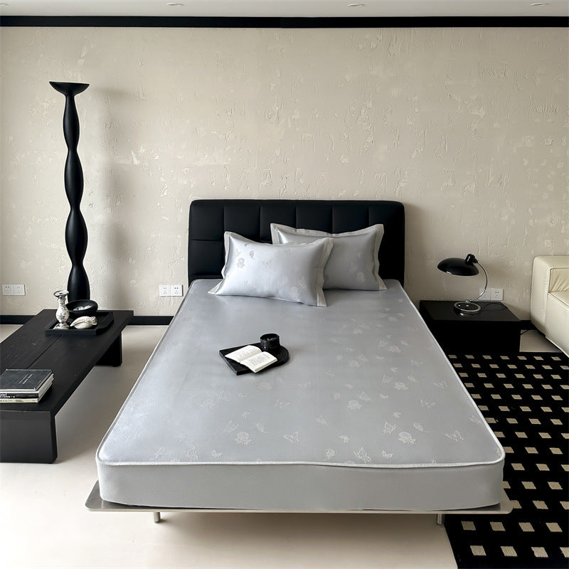 high-quality non-slip mattress protector with integrated fitted sheet and elegant jacquard pattern
