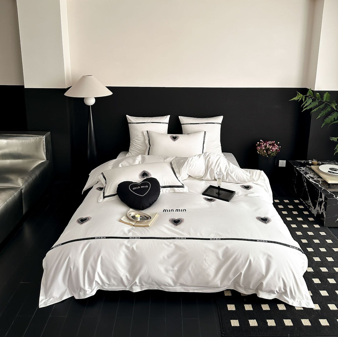 Luxurious cotton satin bedding set with heart applique and decorative piping