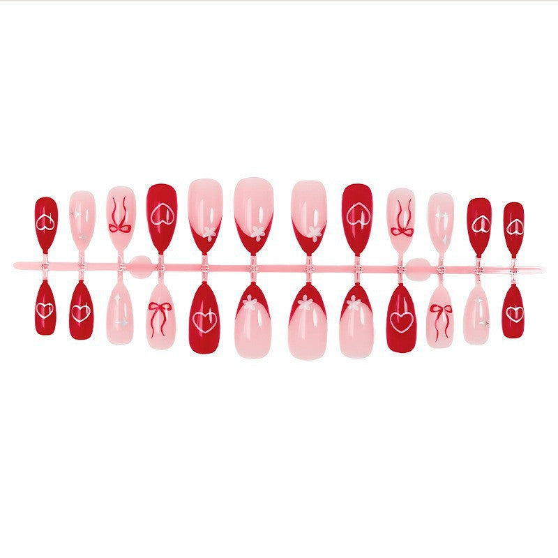 Artificial nail set with romantic hearts and bows Stornfield
