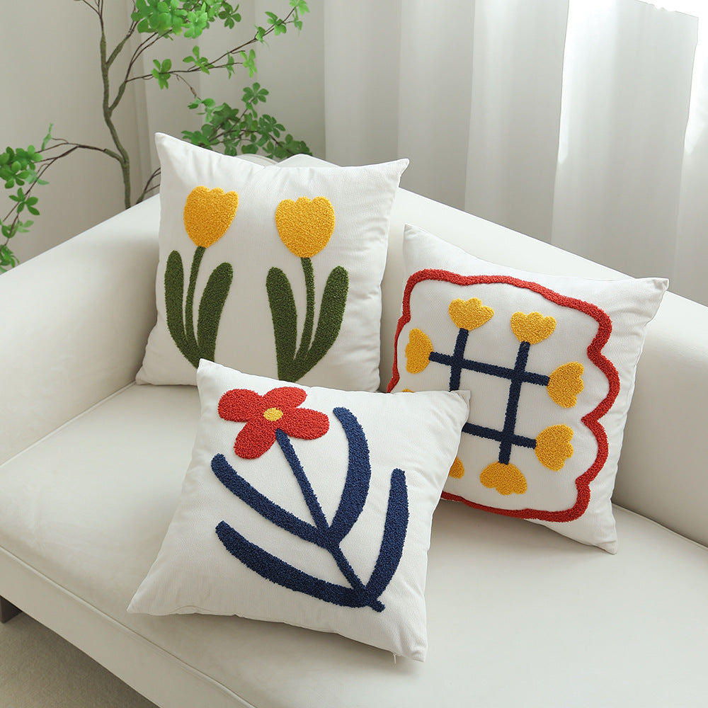 Square decorative cushion with hand-tufted heart ornament and contrasting border