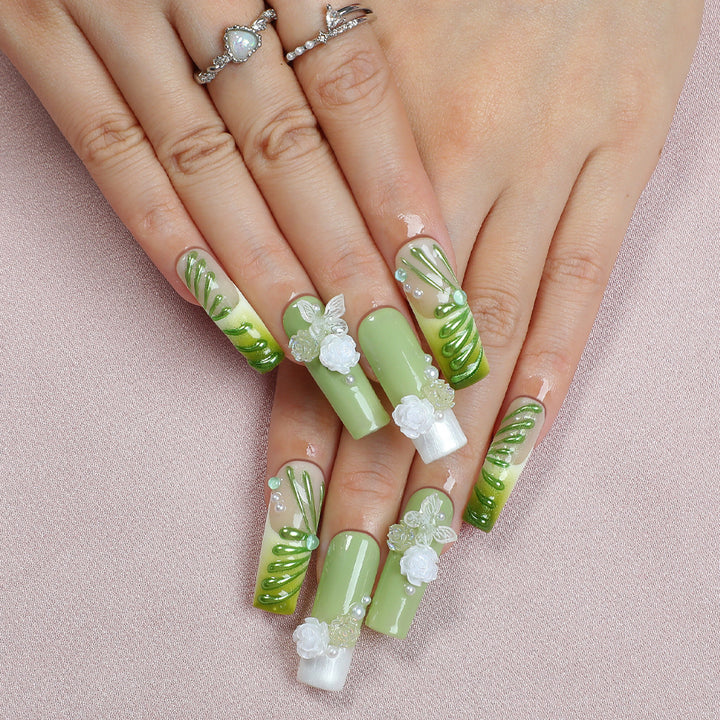 Creative nail set with floral design and delicate accents Stornfield