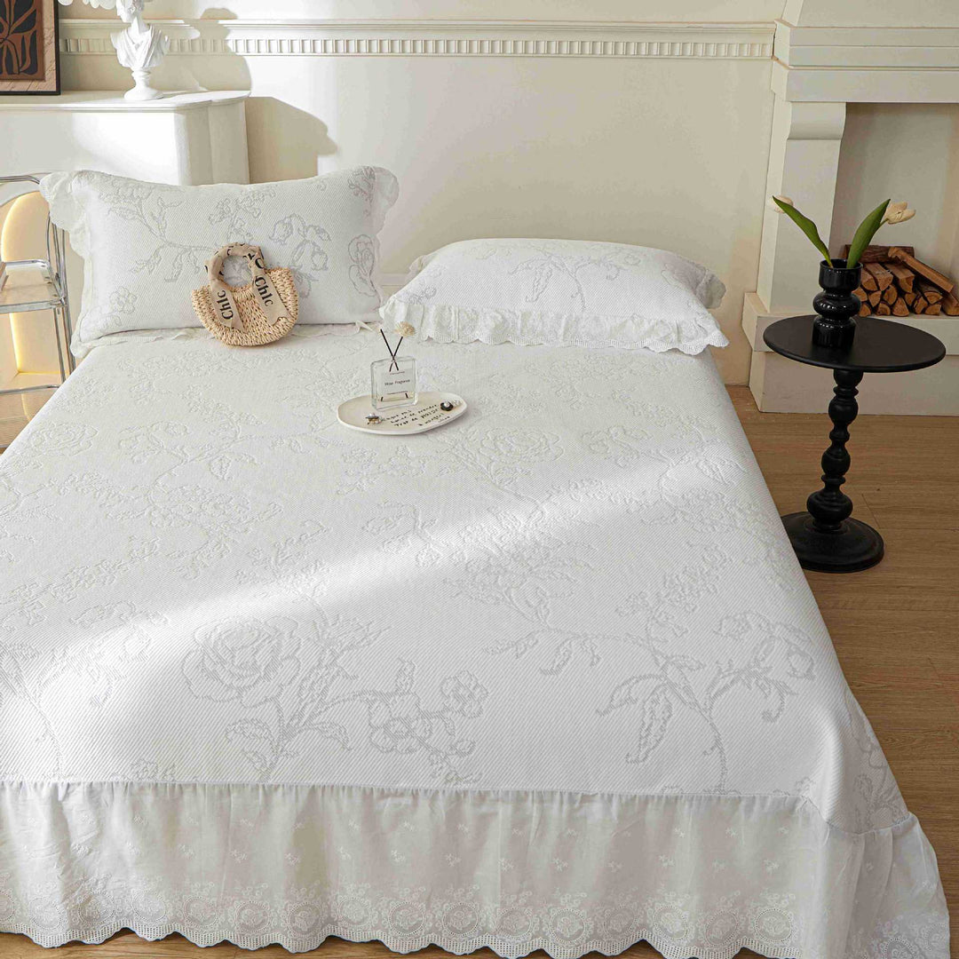 Bedspread with waffle structure and subtle snowflake embroidery