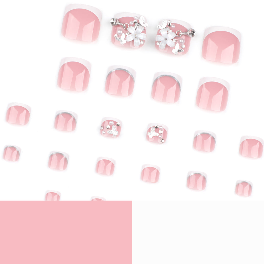 Artful toenail design with elegant flower and glitter accents Stornfield