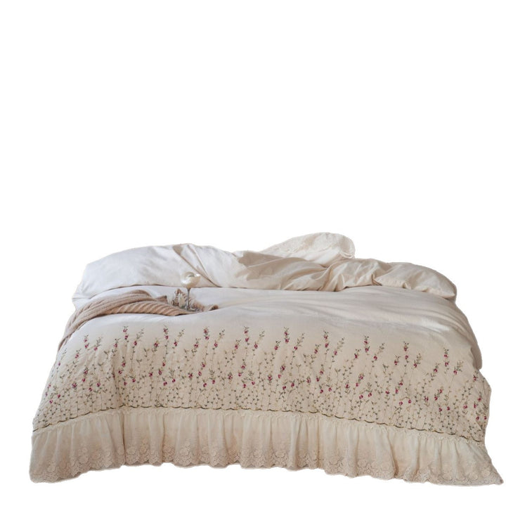 Vintage-inspired ruffled blanket and pillow set made of cotton muslin with delicate floral embroidery