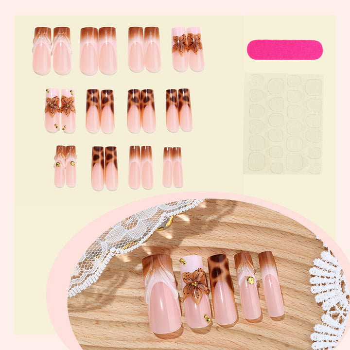 Creative nail art set with floral accents and ombre effect Stornfield