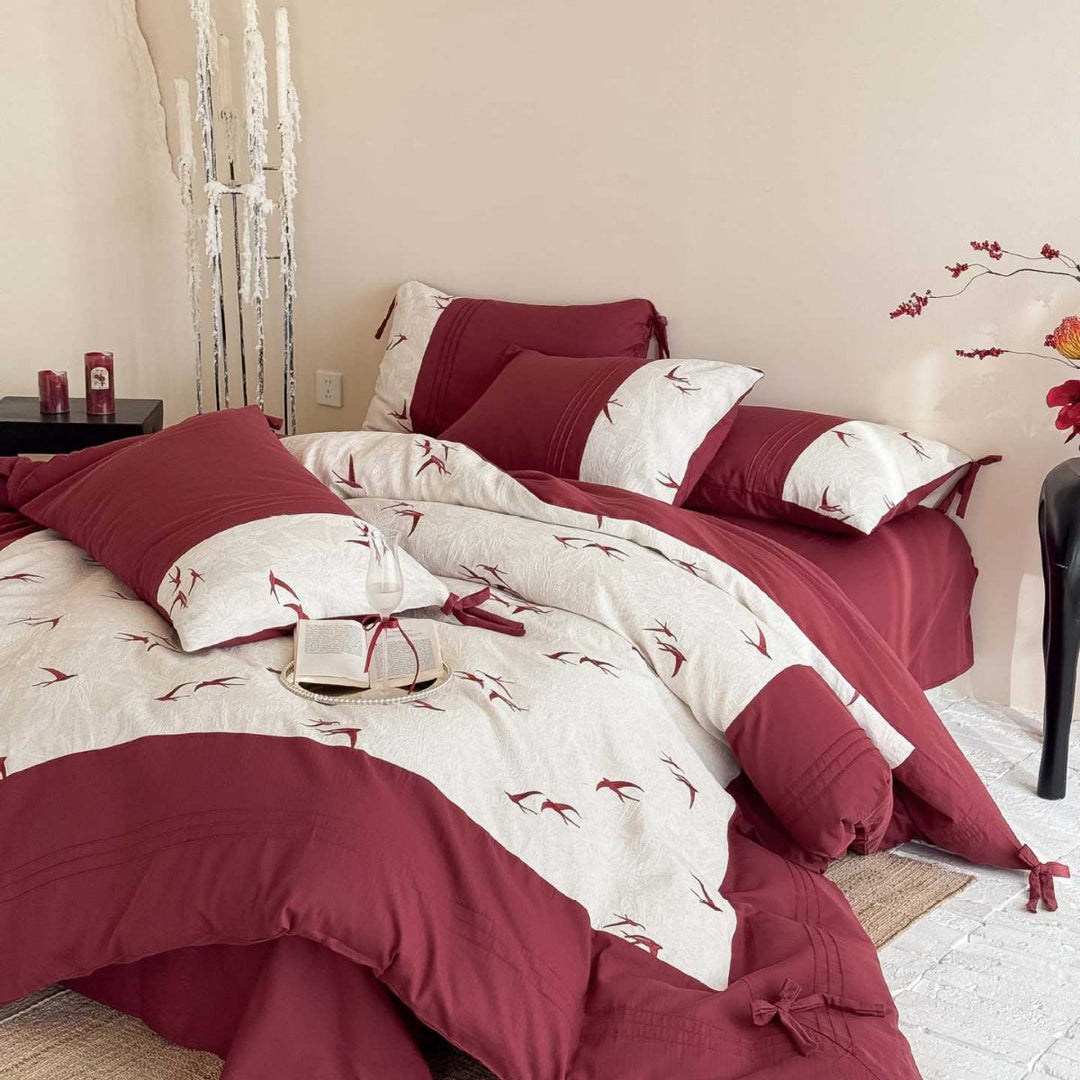 Luxurious cotton bedding set with swallow embroidery and bow accents