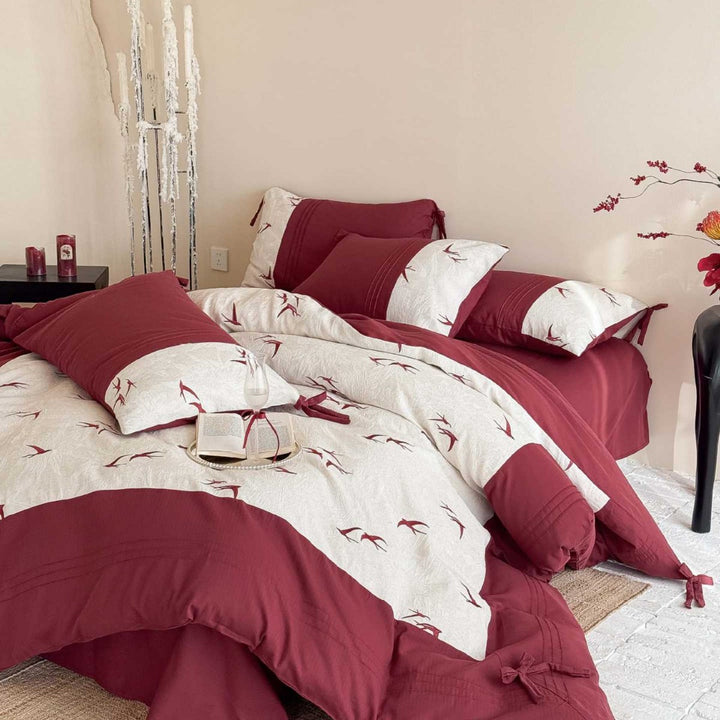 Luxurious cotton bedding set with swallow embroidery and bow accents