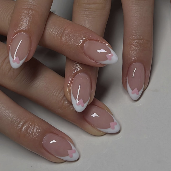 Artificial nail art with playful dots and bows Stornfield