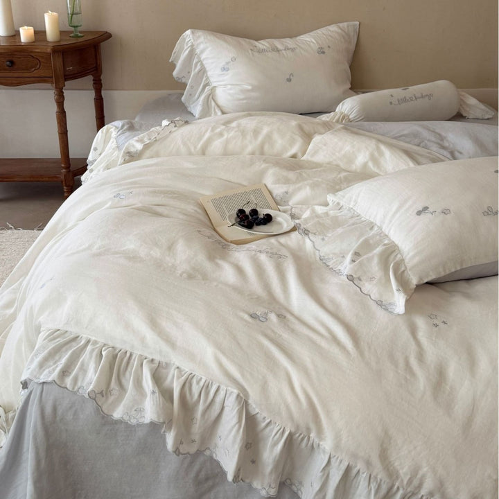 Romantic cotton bedding set with ruffles and delicate embroidery