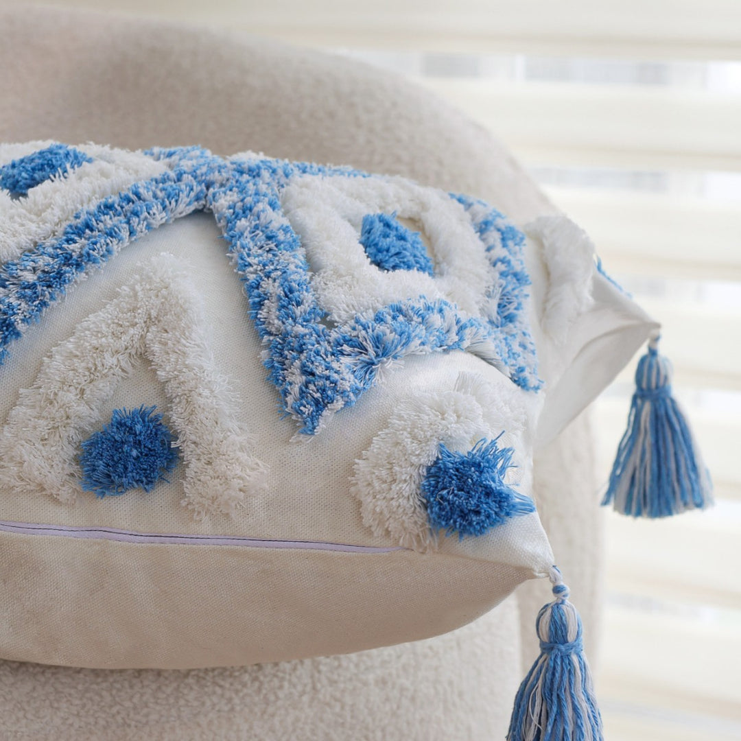 Square handwoven cushion cover made of cotton-linen with raised stripe tufting and corner tassels Stornfield