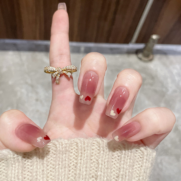 Artificial nails with heart accent and glamorous decorations Stornfield