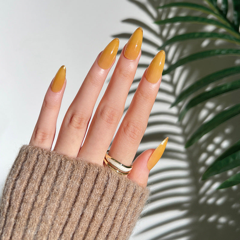 Artificial stiletto nails with glamorous glitter accent Stornfield