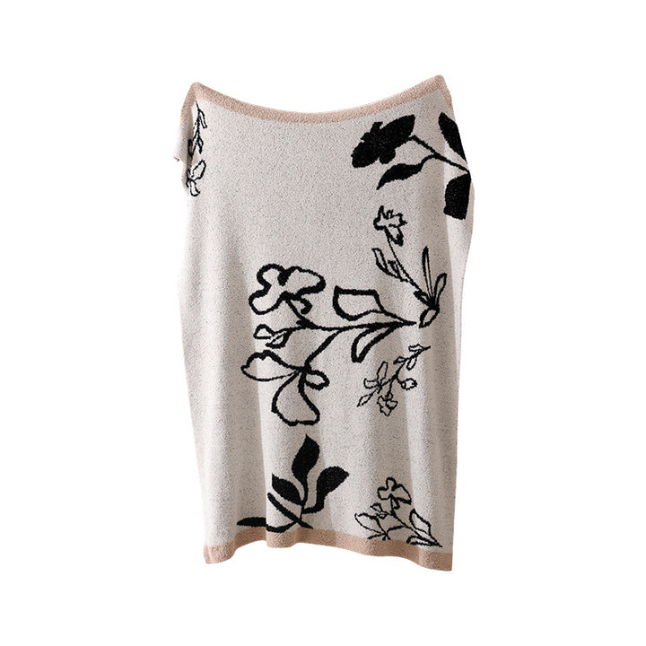Coarsely woven decorative blanket with geometric jacquard pattern and soft bouclé Stornfield