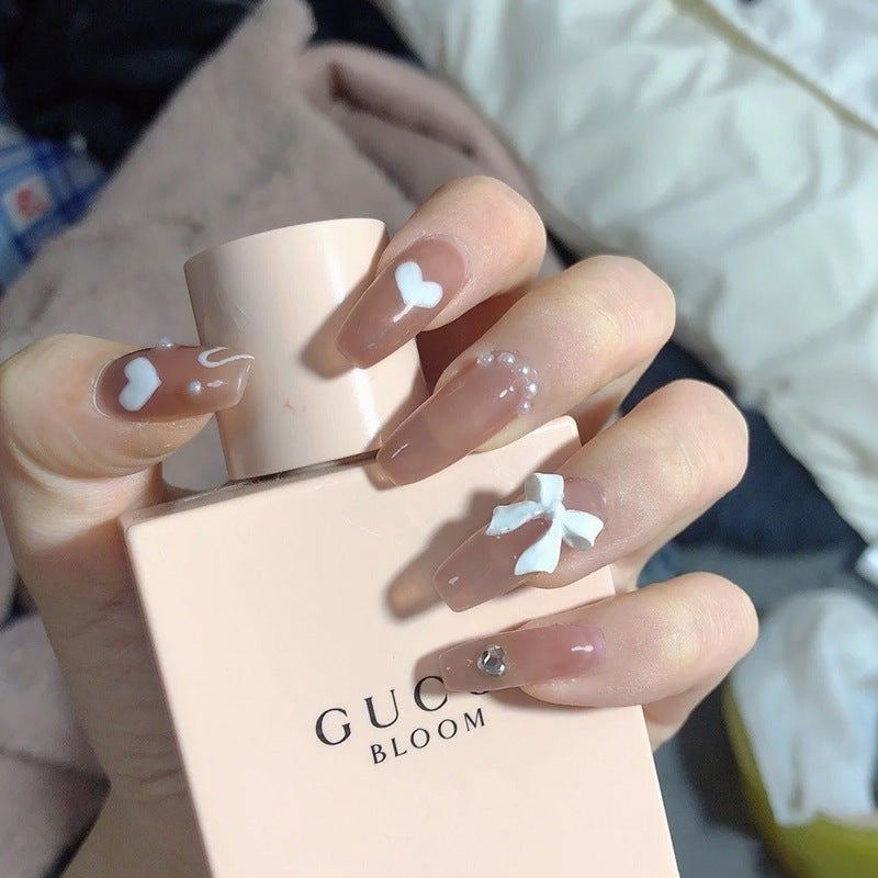 Artificial nails with heart accent and glamorous decorations Stornfield