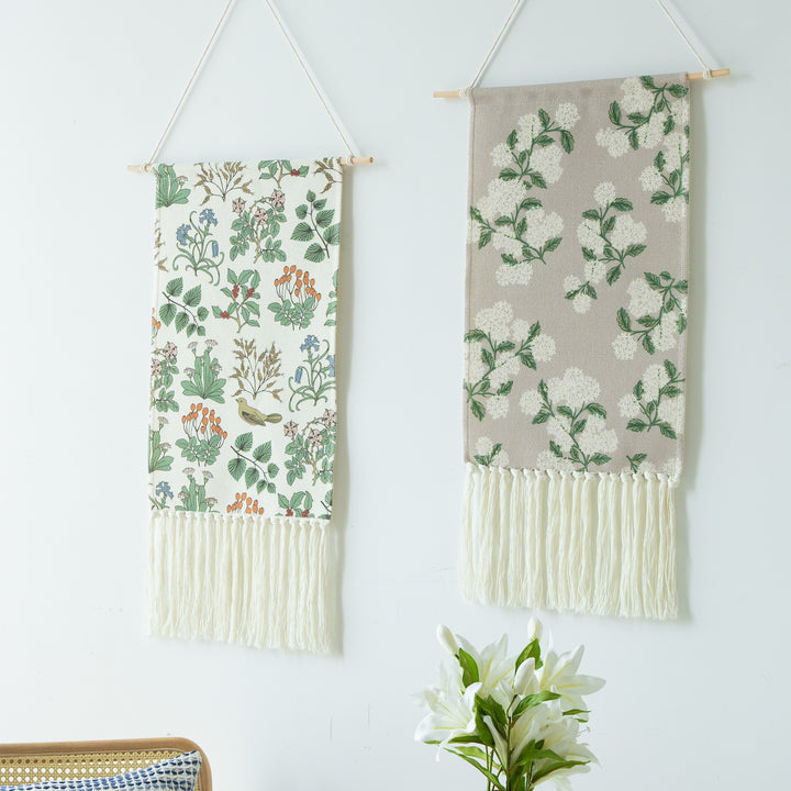 Woven wall hanging with floral jacquard structure and long fringes Stornfield