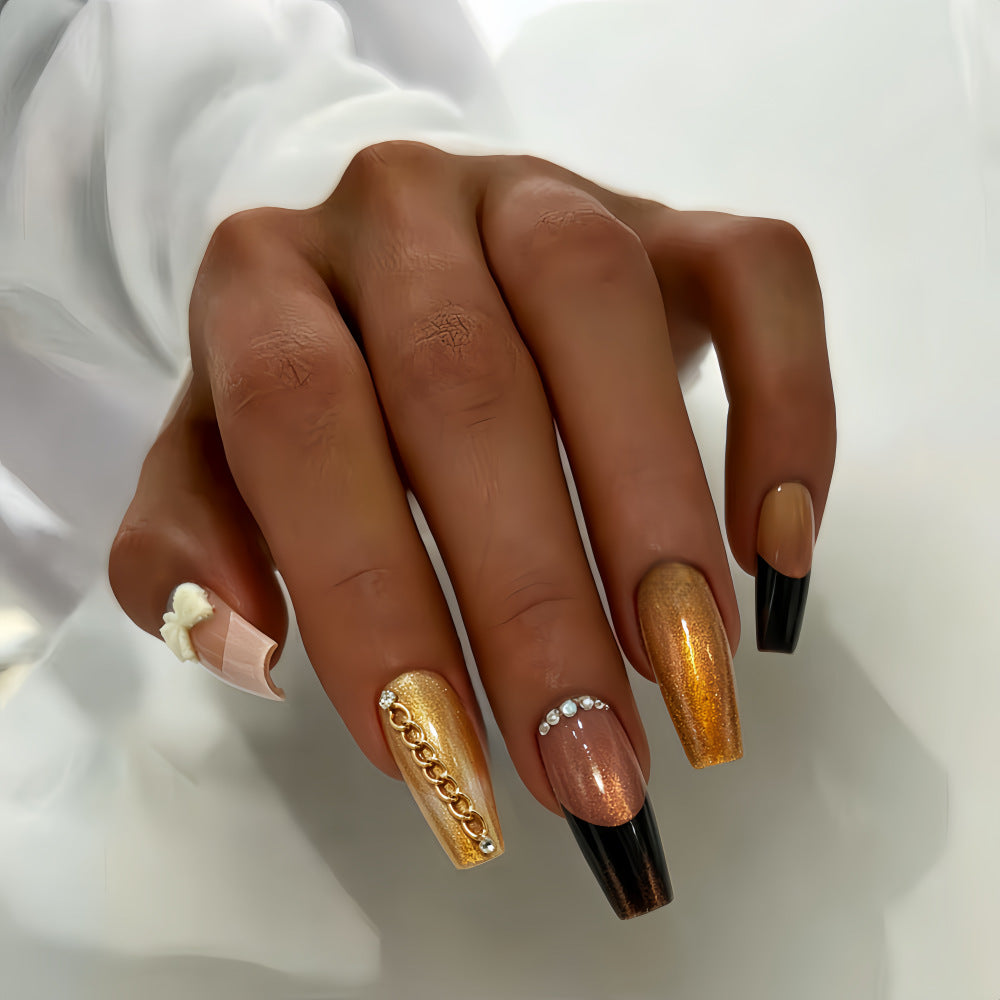 Glamorous artificial nails with glittering design and elegant embellishments Stornfield