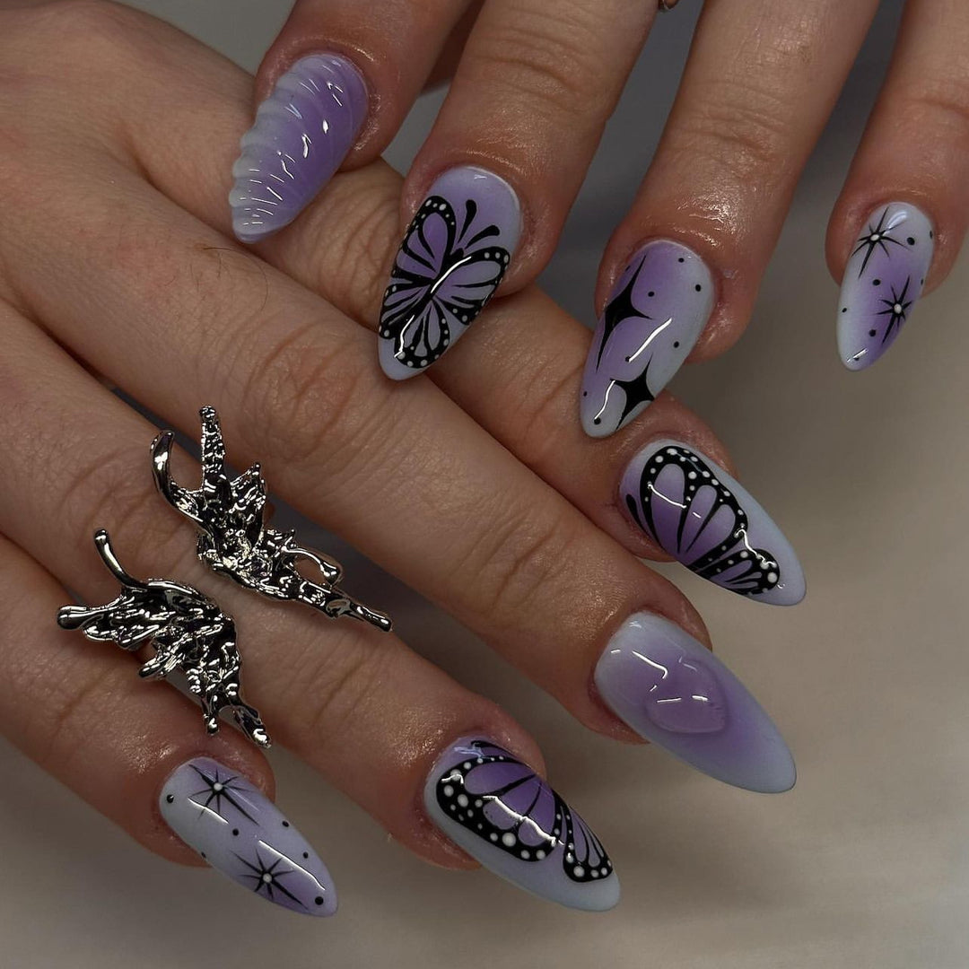Artful stiletto nails with elegant butterfly design Stornfield