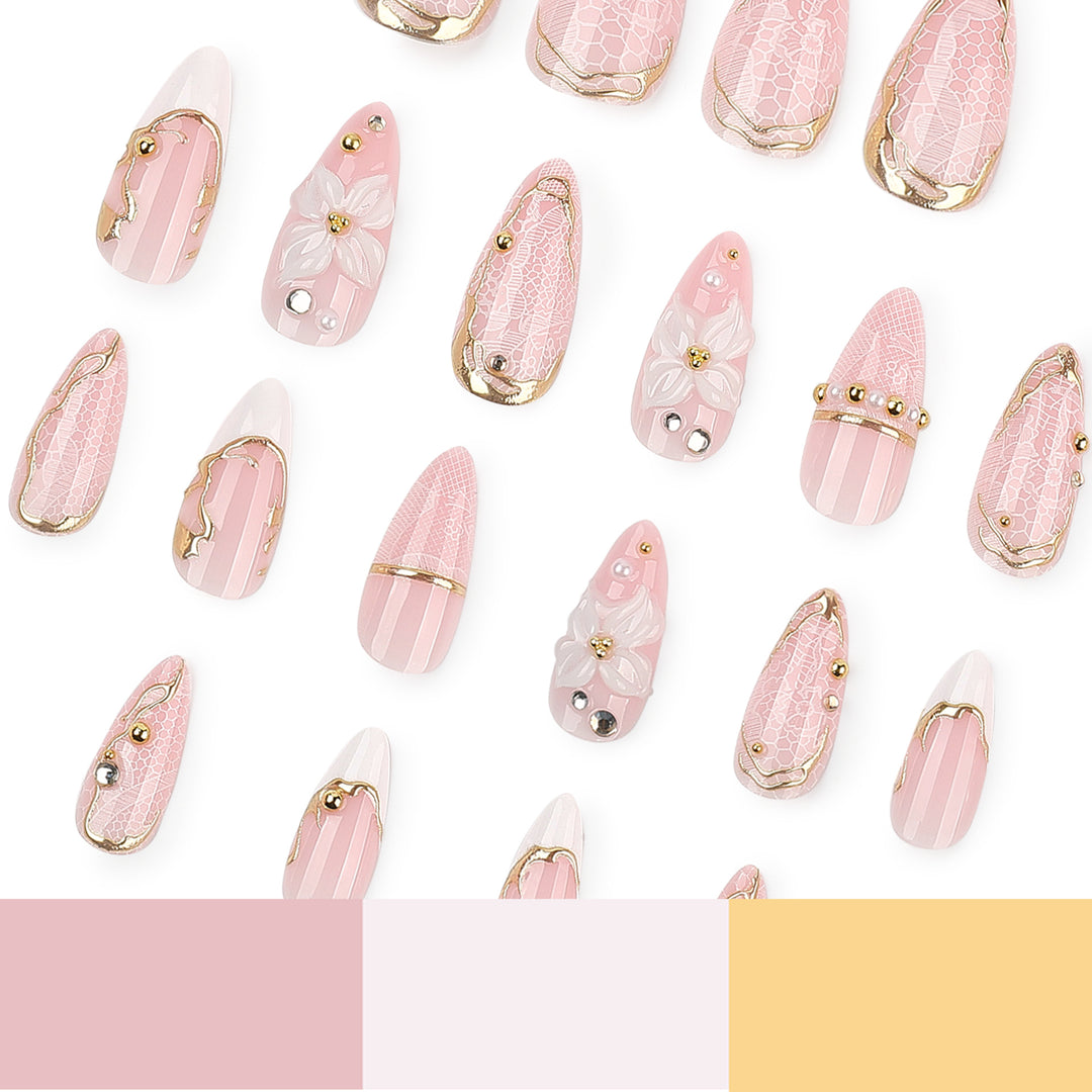 Artful nail extensions with delicate flower and gold embellishments Stornfield