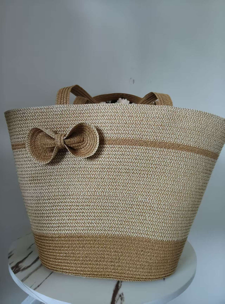 Elegant straw bag with decorative bow closure Stornfield