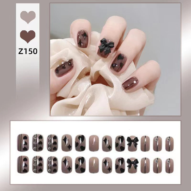 Artificial nails with elegant ribbon and heart designs Stornfield