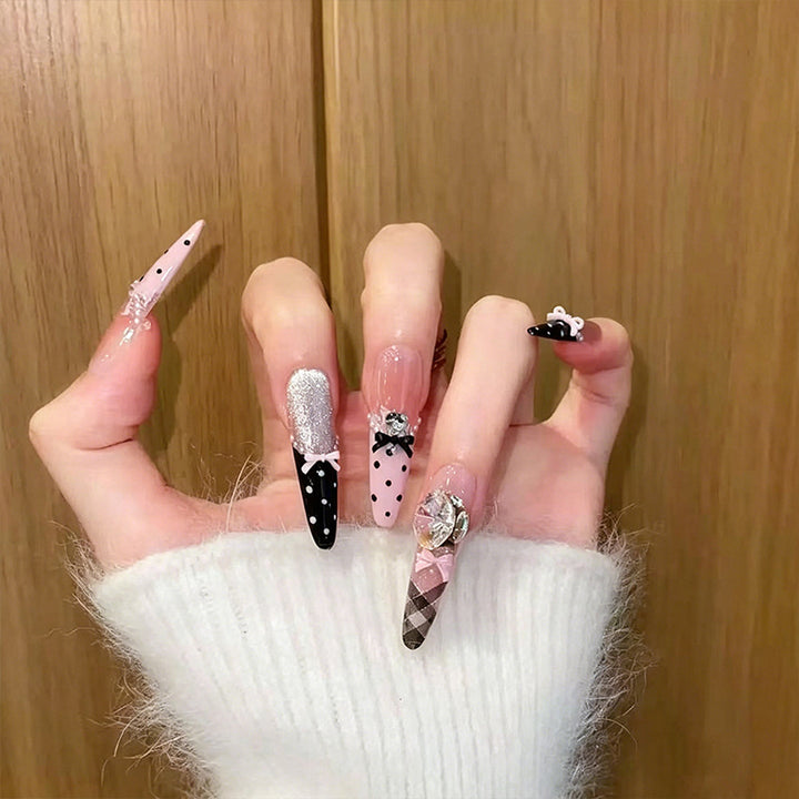 Artificial nail set with glamorous 3D applications and festive design Stornfield