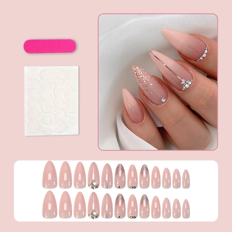 Glamorous artificial nails with rhinestone accents and shimmering effects Stornfield