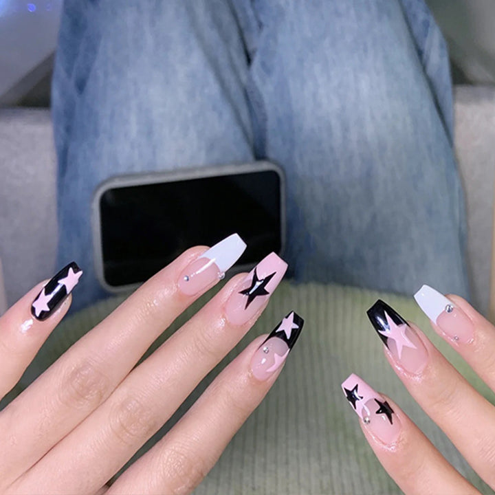 Artificial nail set with glamorous star design and sparkling accents Stornfield
