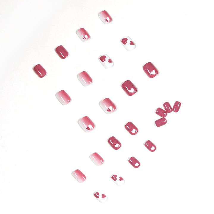 Creative nail art with heart motif and high-gloss finish Stornfield