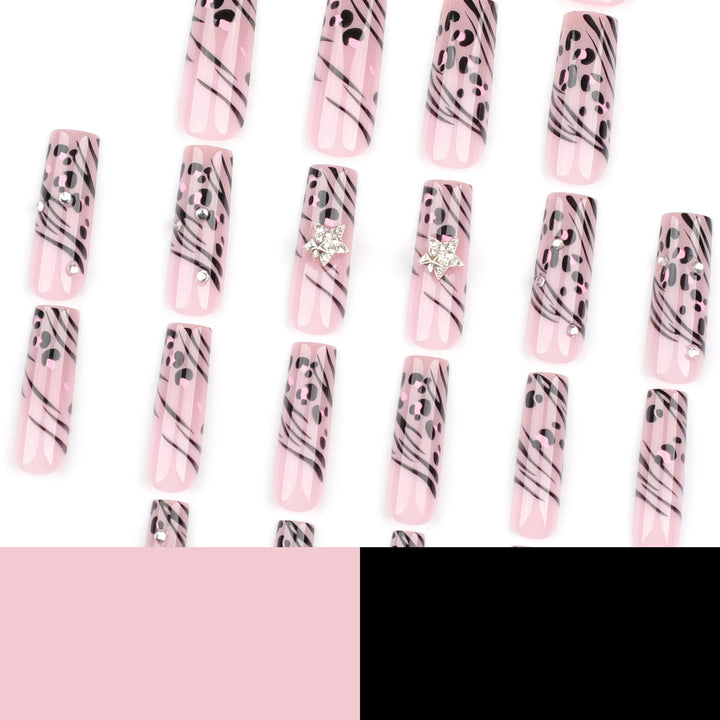 Artful Nail Art with Zebra Pattern and Glitter Accents Stornfield