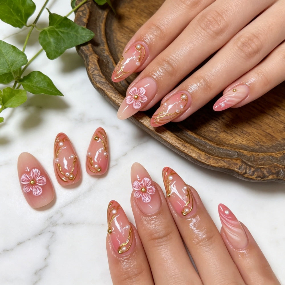 Artificial nails with floral decorations and gold accents Stornfield