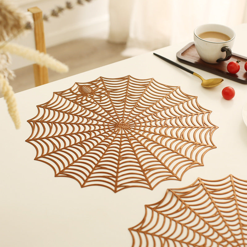 Round filigree spider web placemat made of heat- and water-repellent PVC for table decoration