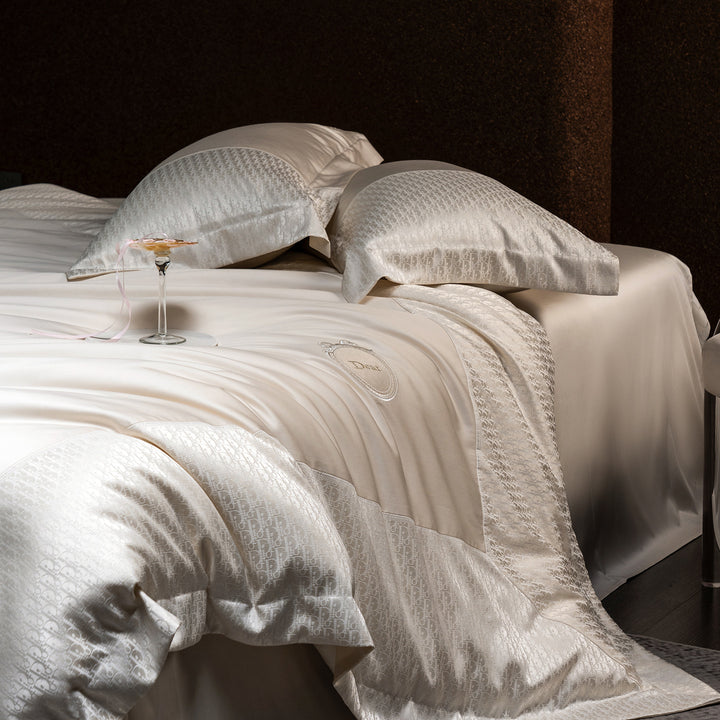 Luxurious satin bedding set with jacquard trim and embroidered coat of arms