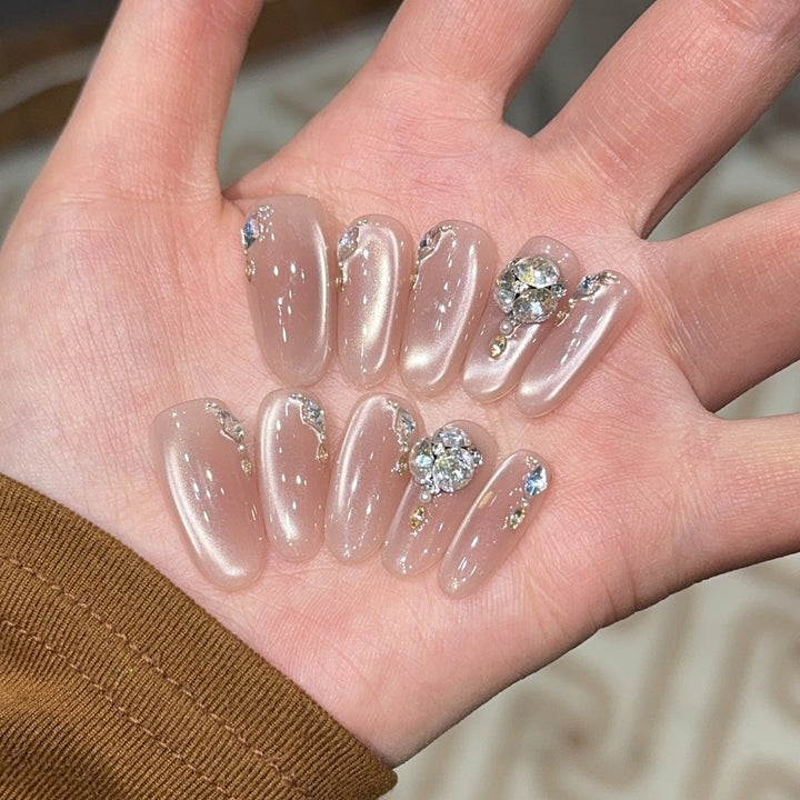 Glamorous artificial nails with rhinestone embellishments Stornfield