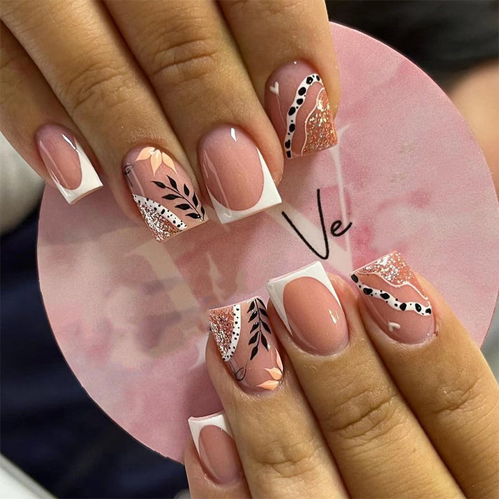 Trendy artificial nails in flower and glitter pattern Stornfield