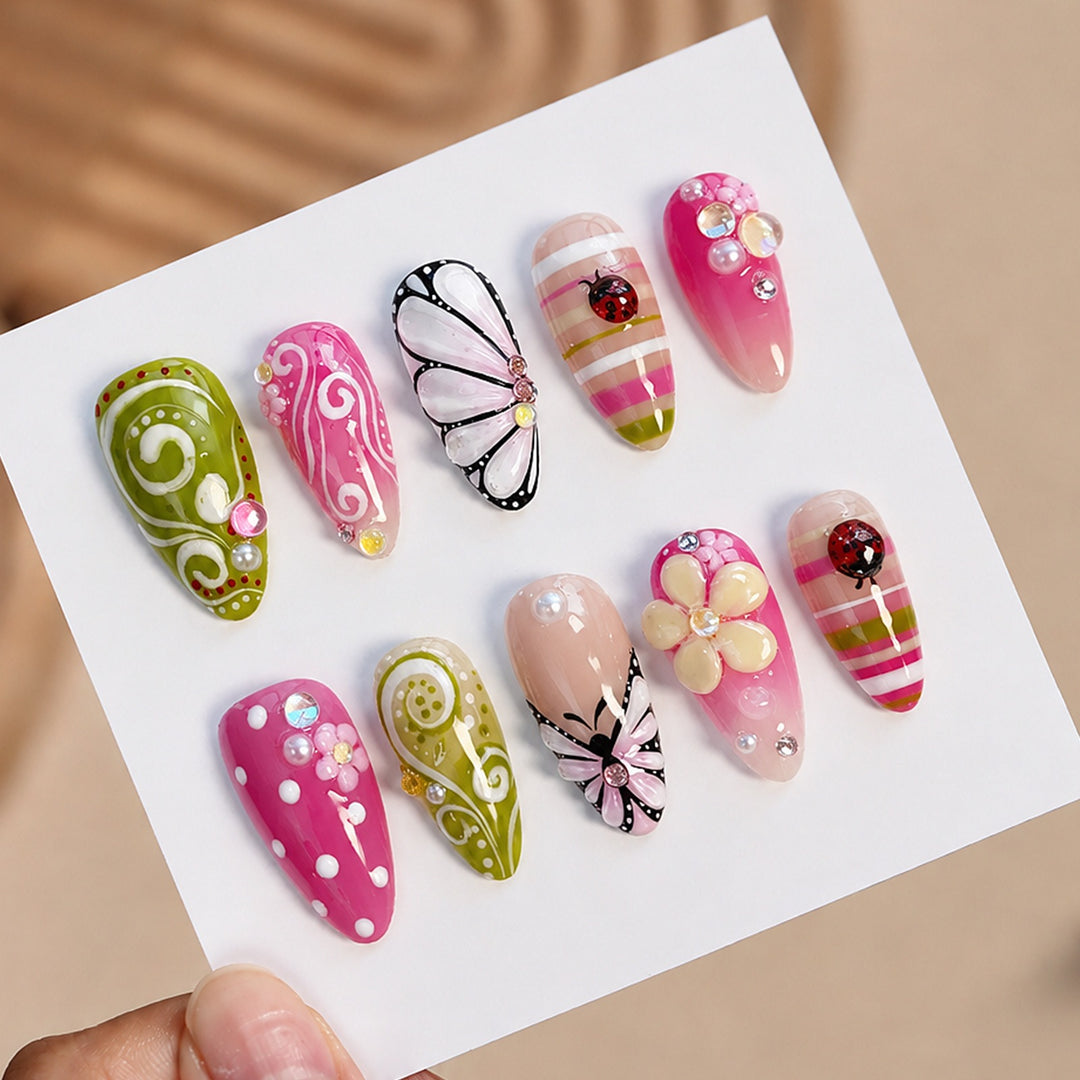 Artificial nail set with playful floral and glitter motifs Stornfield