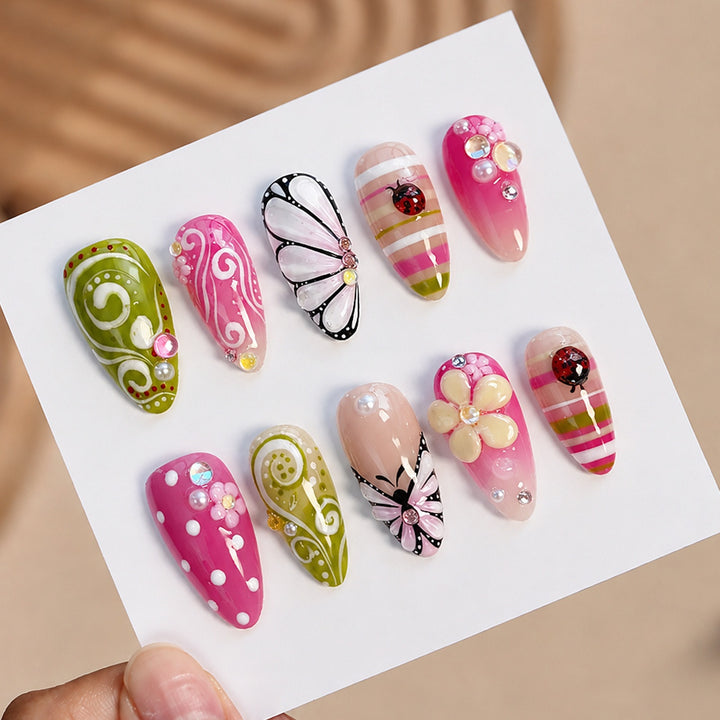 Artificial nail set with playful floral and glitter motifs Stornfield