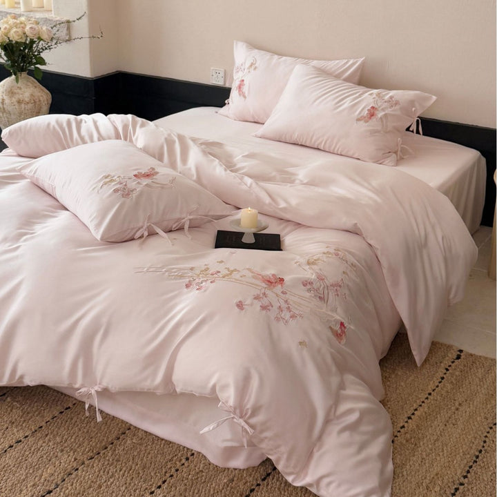 Embroidered satin bedding set with ribbon ties and delicate floral embroidery Stornfield