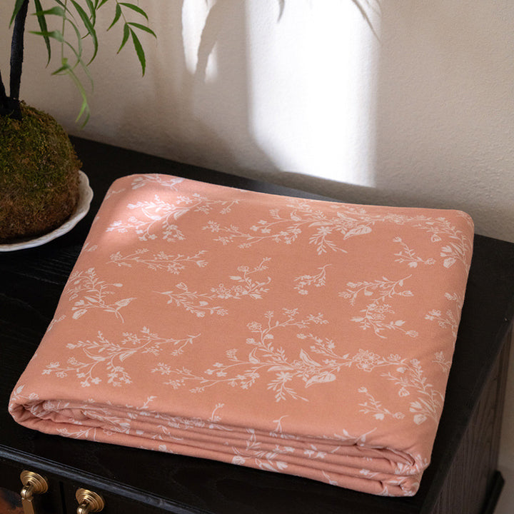 Organic Cotton Muslin Swaddle Blanket with Playful Cartoon Print