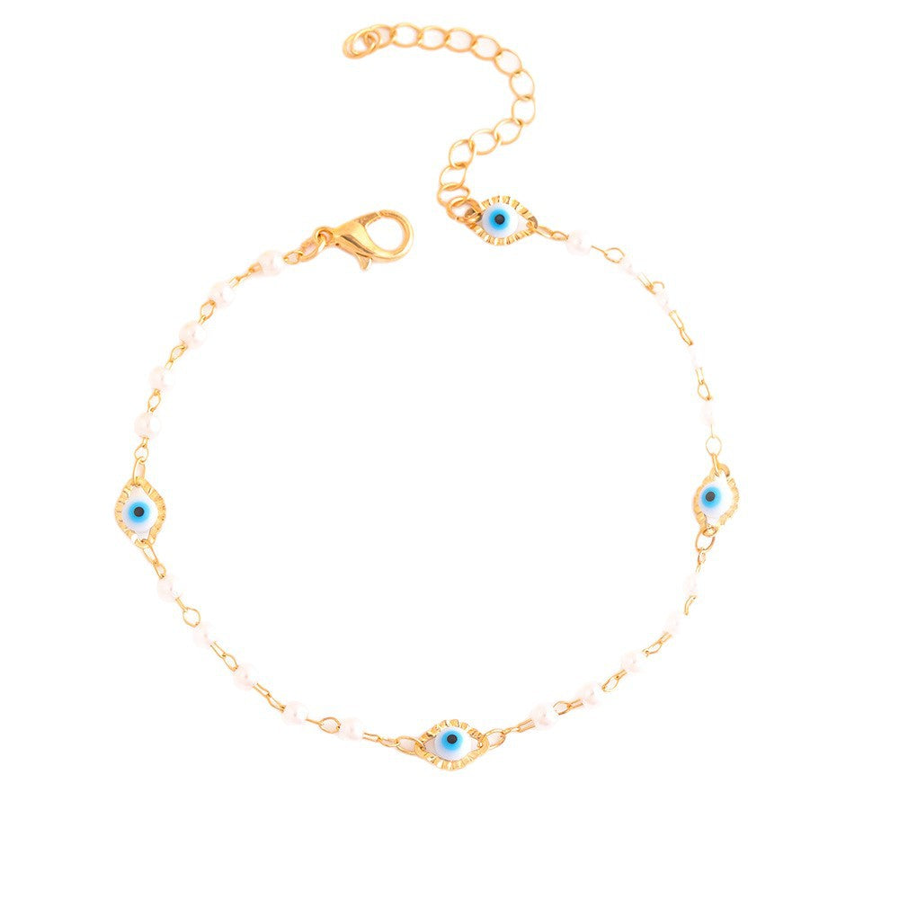 Elegant Pearl and Eye Charm Necklace Stornfield
