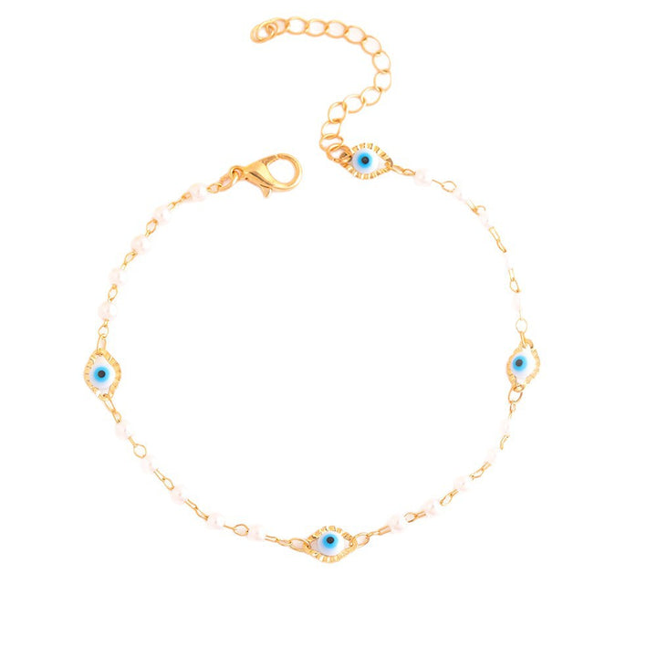 Elegant Pearl and Eye Charm Necklace Stornfield