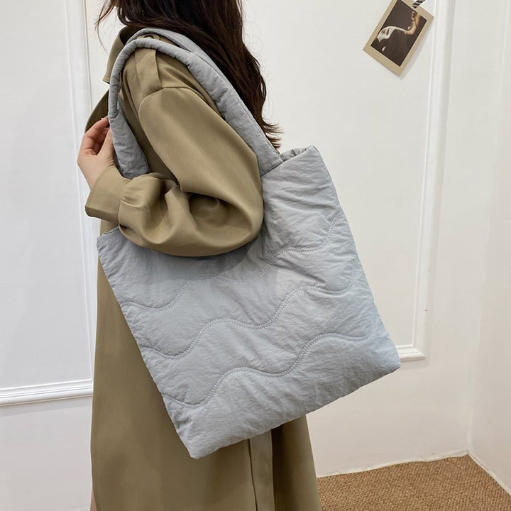 Padded shoulder bag with wave design Stornfield