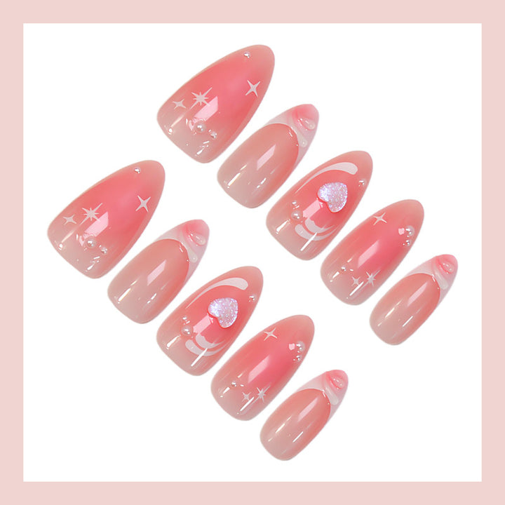 Acrylic nail set with romantic heart design and glitter accents Stornfield
