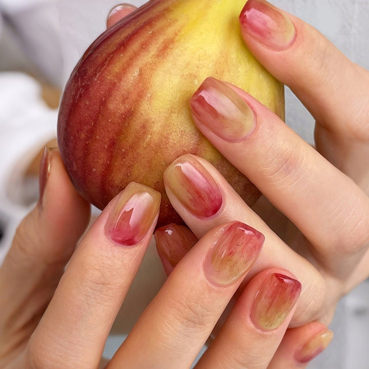 Acrylic nail set with elegant color gradients and creative accents Stornfield