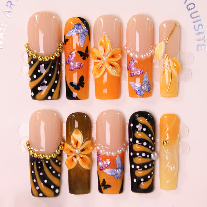 Artificial nail set with elegant flower and butterfly designs Stornfield