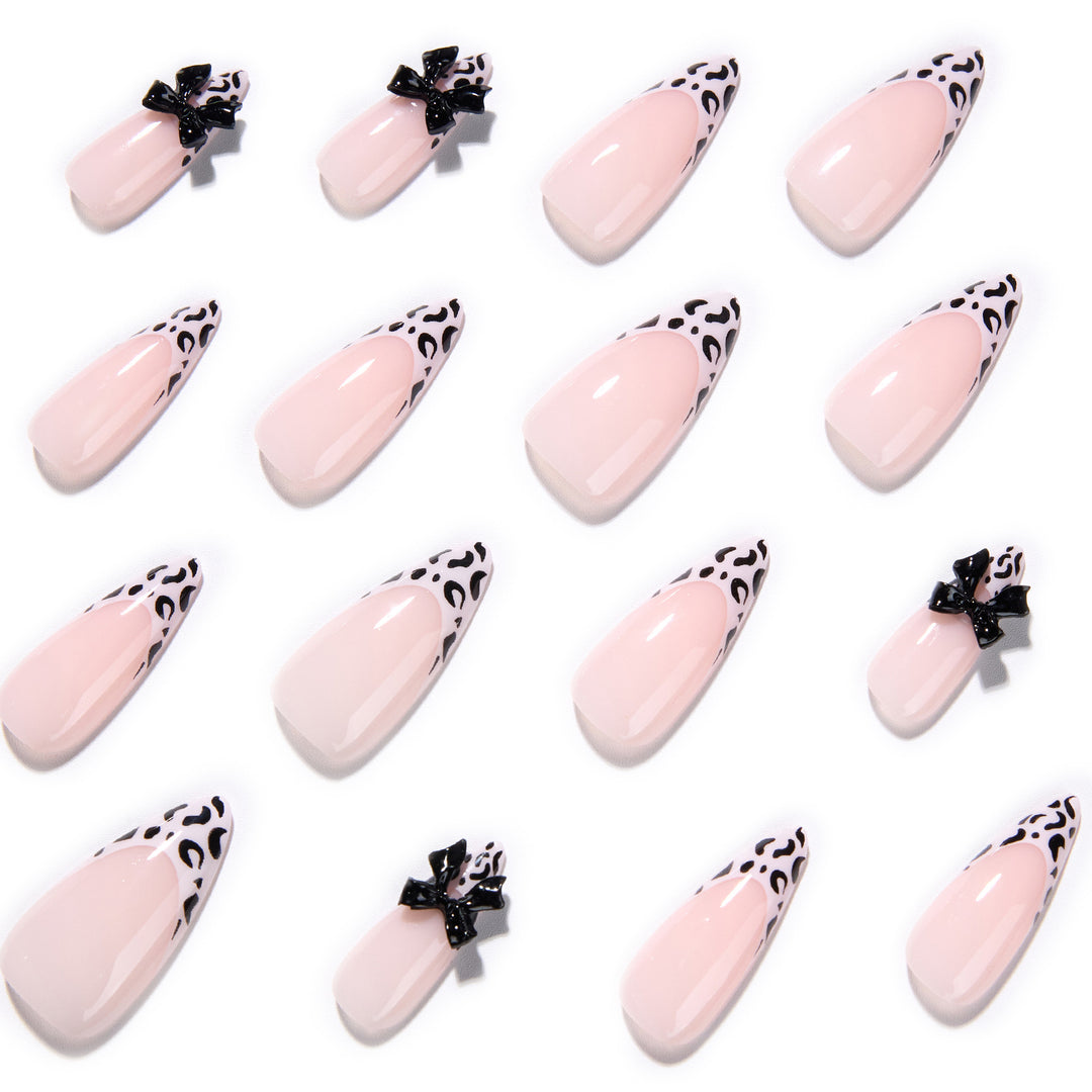 Artful Stiletto Nails with Leopard Print and Bow Accent Stornfield
