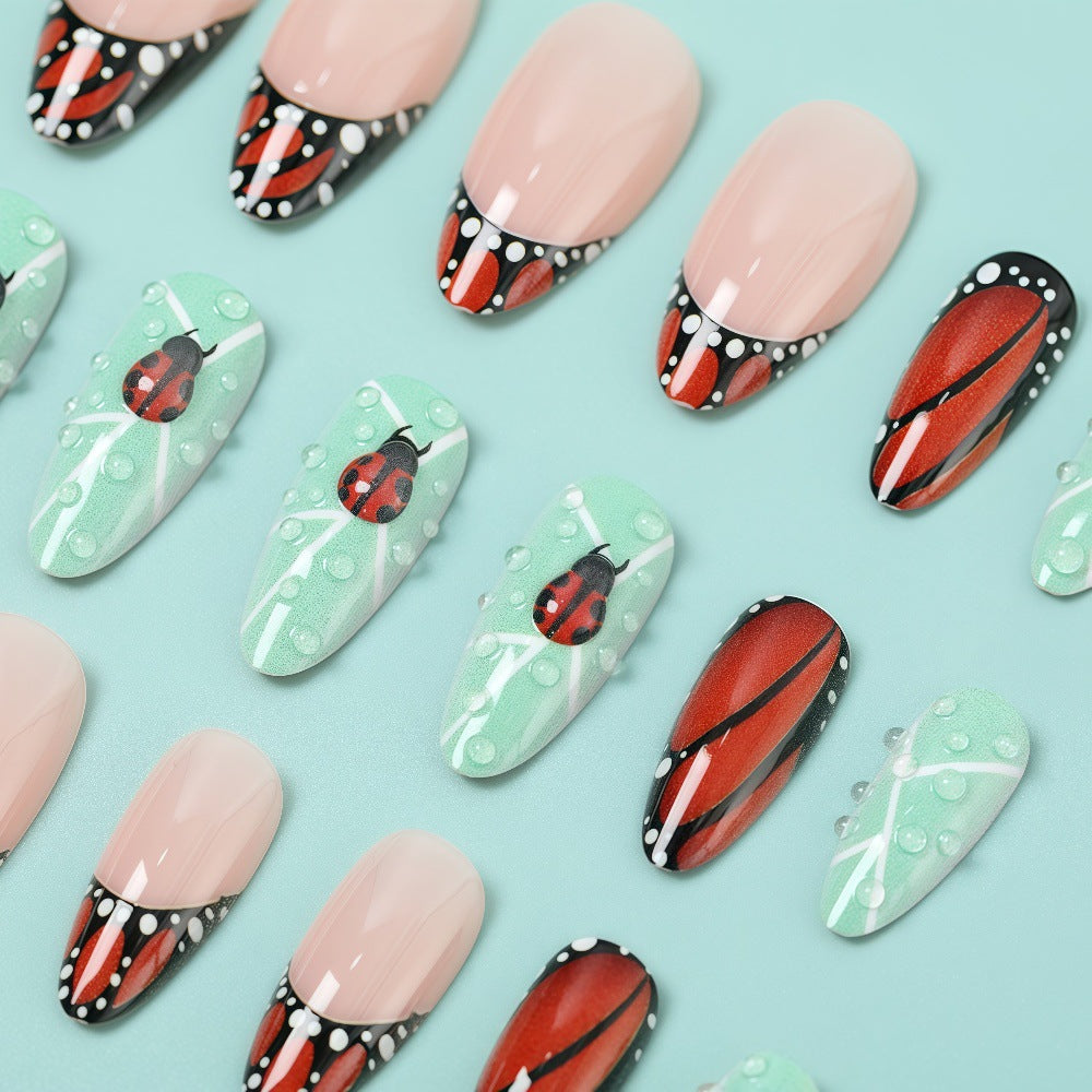 Creative nail art with elaborate butterfly and flower designs Stornfield