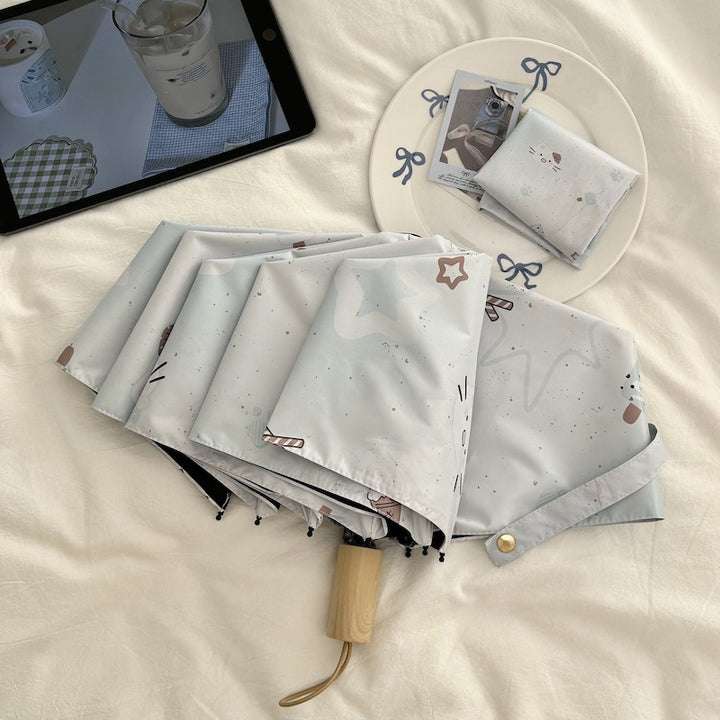 Women's compact folding umbrella with cute Stornfield motif