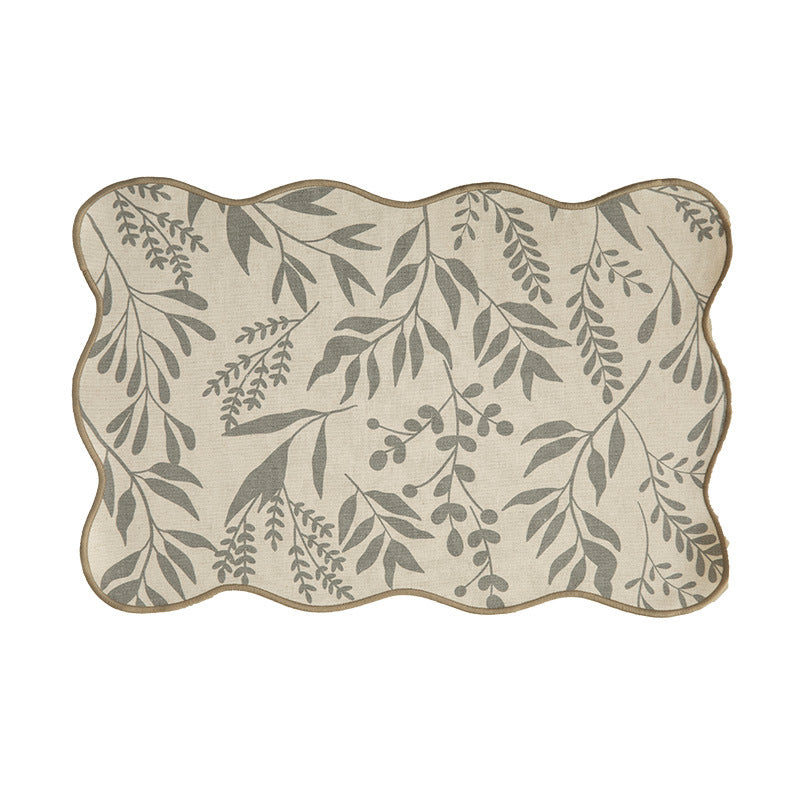 Shaped table set with curved contour and botanical leaf pattern Stornfield